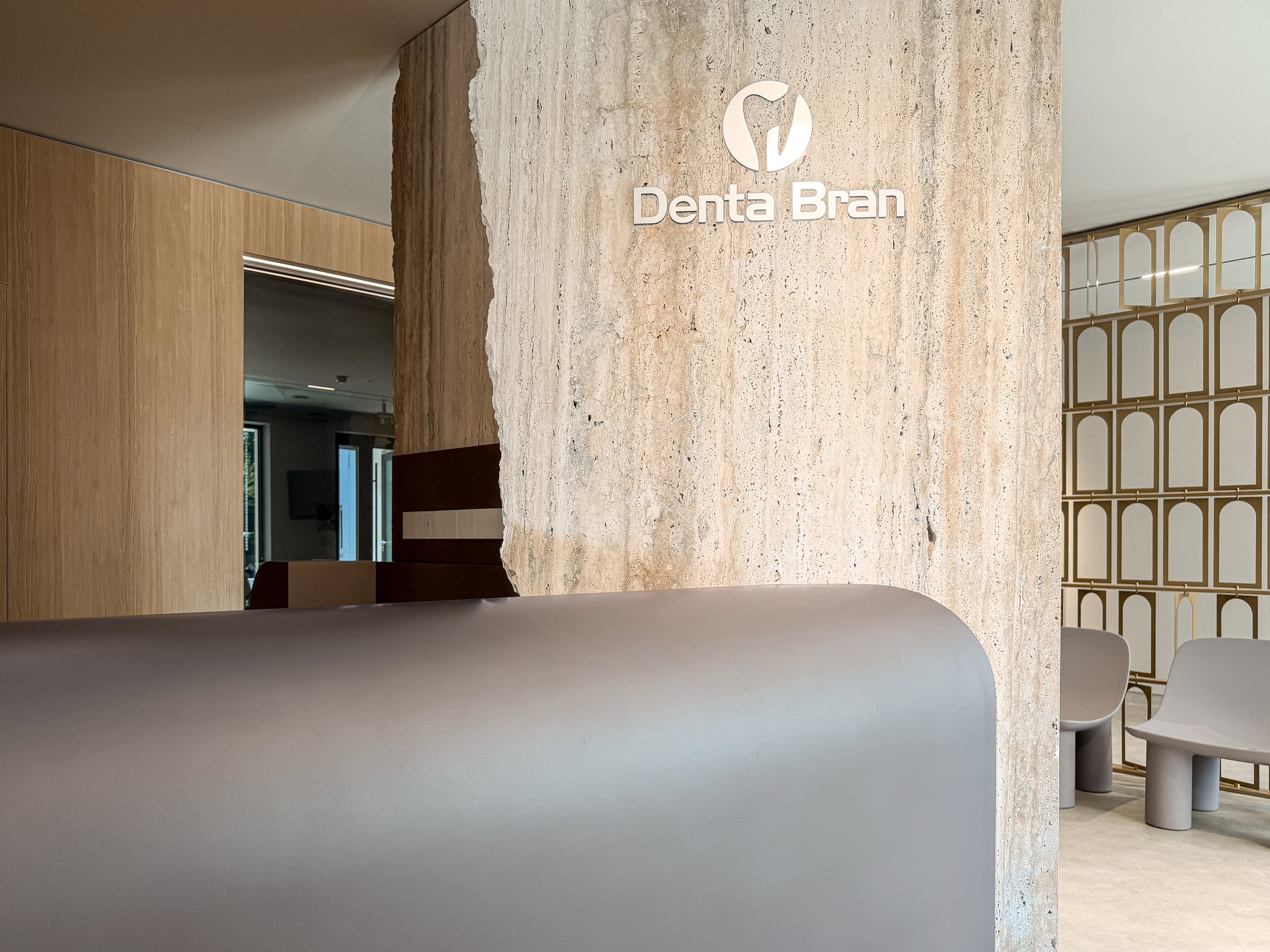 Dental Clinic Alba Iulia — Travertine reception and logo